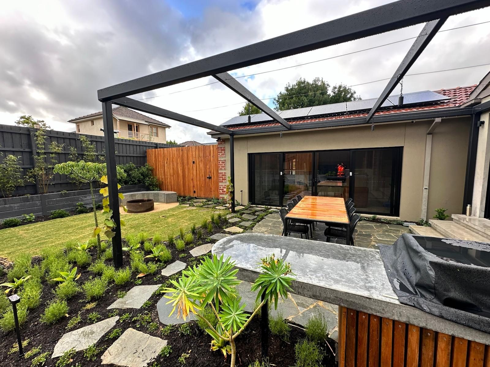 Landscaping, layered garden beds and planting by Eden